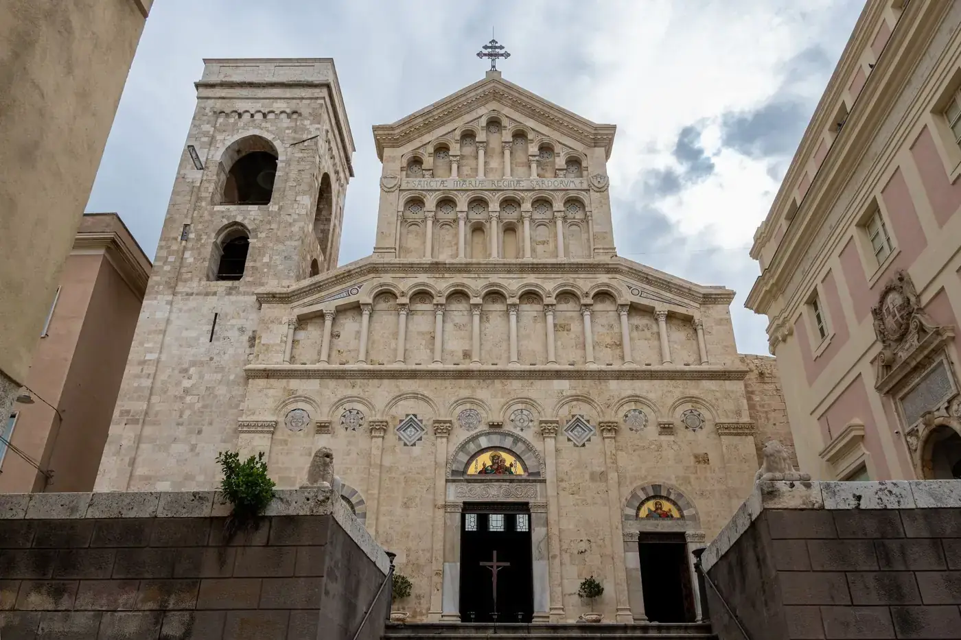 Front view of the historic Cagliari Cathedral’s facade showcasing romanesque architecture in Sardinia, Italy.