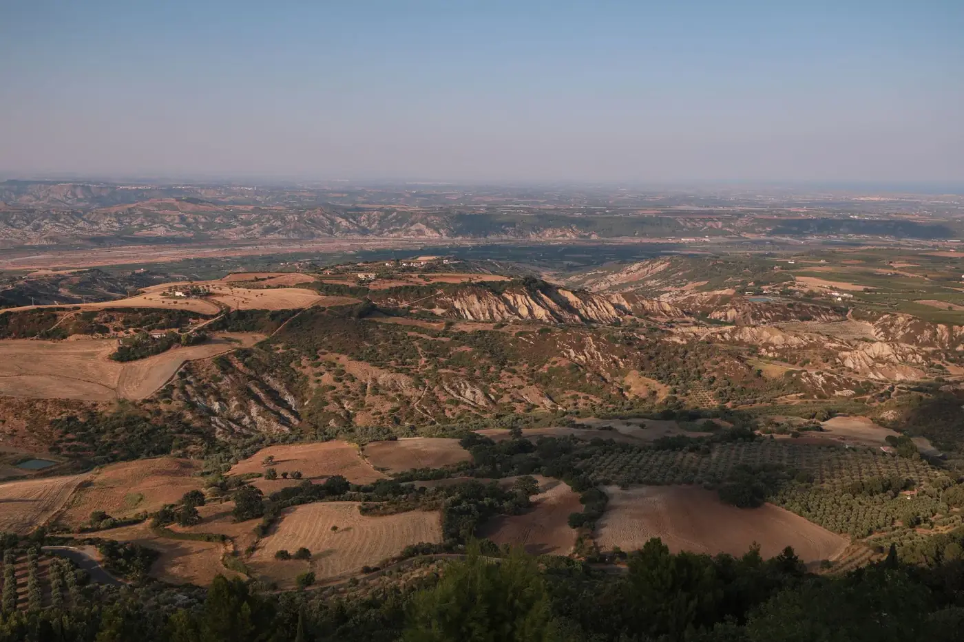 Stunning aerial view of Rotondella's rural landscape in Basilicata, Italy.