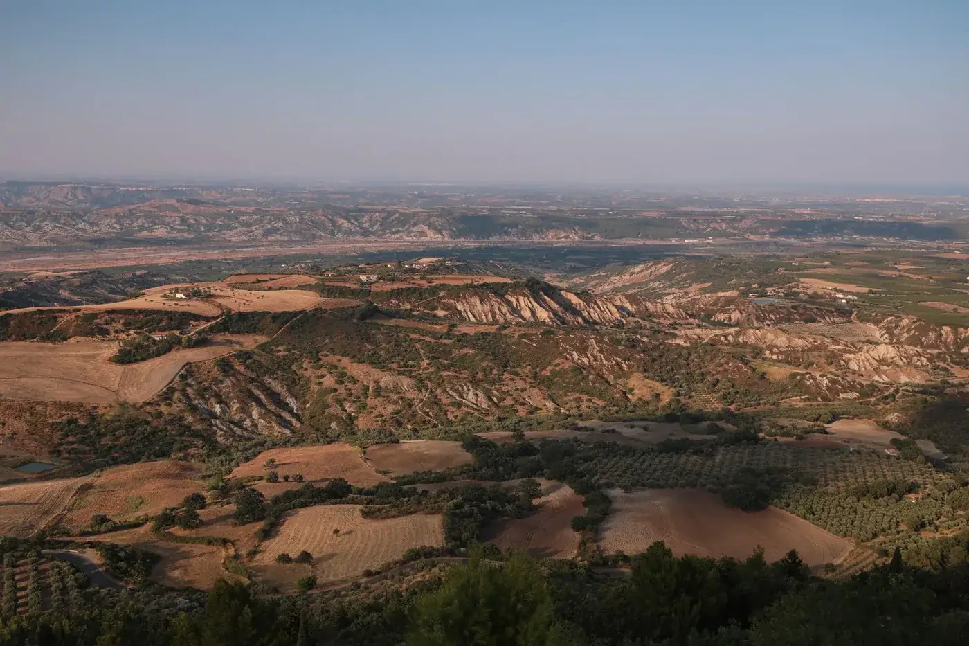 Stunning aerial view of Rotondella's rural landscape in Basilicata, Italy.