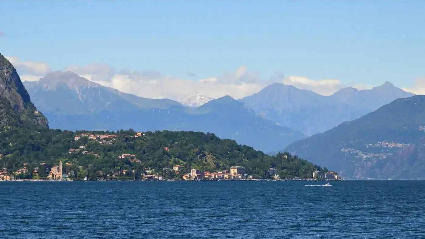 Scenic view of Lake Maggiore with mountainous backdrop, perfect for travel and nature enthusiasts.