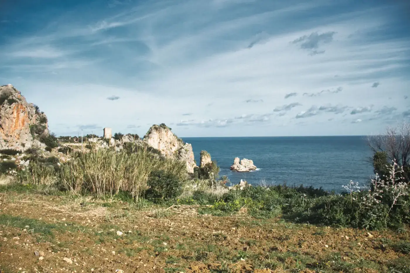 Explore the breathtaking coastal landscape of Zingaro Nature Reserve with cliffs and sea views in Sicily, Italy.