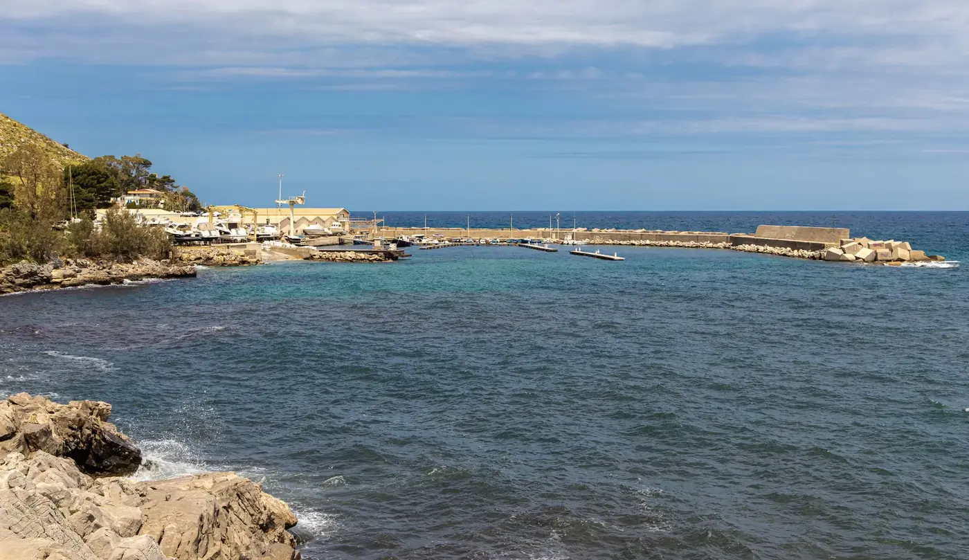 Scenic view of Cala di Palermo's coastline and harbor in Sicily, Italy.