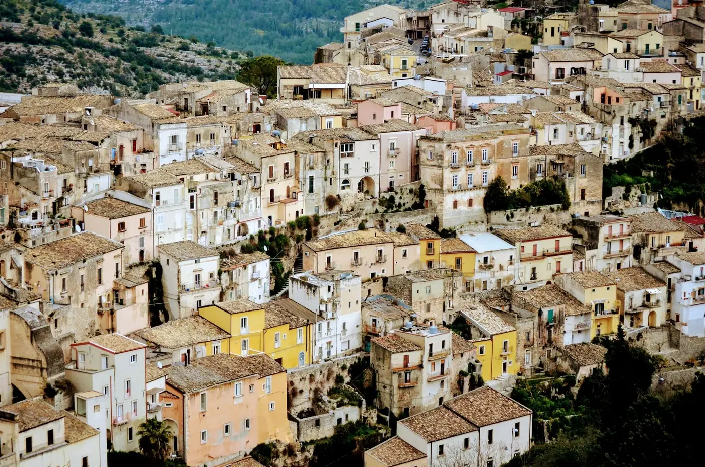 Charming aerial view of historic stone buildings in a picturesque Italian town.