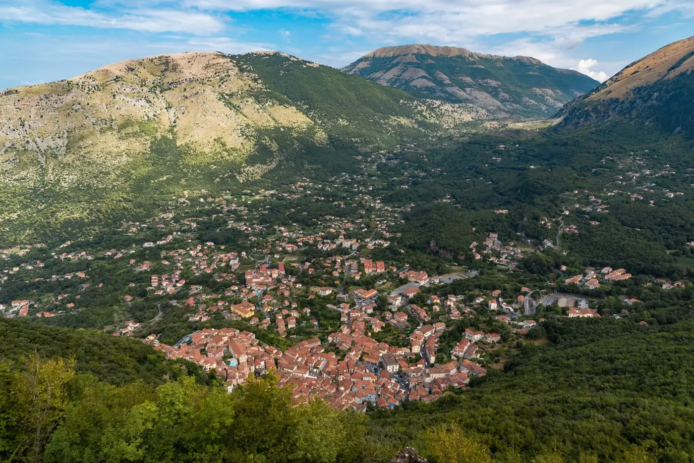 Stunning aerial view of Maratea with lush greenery and mountains in Basilicata, Italy.