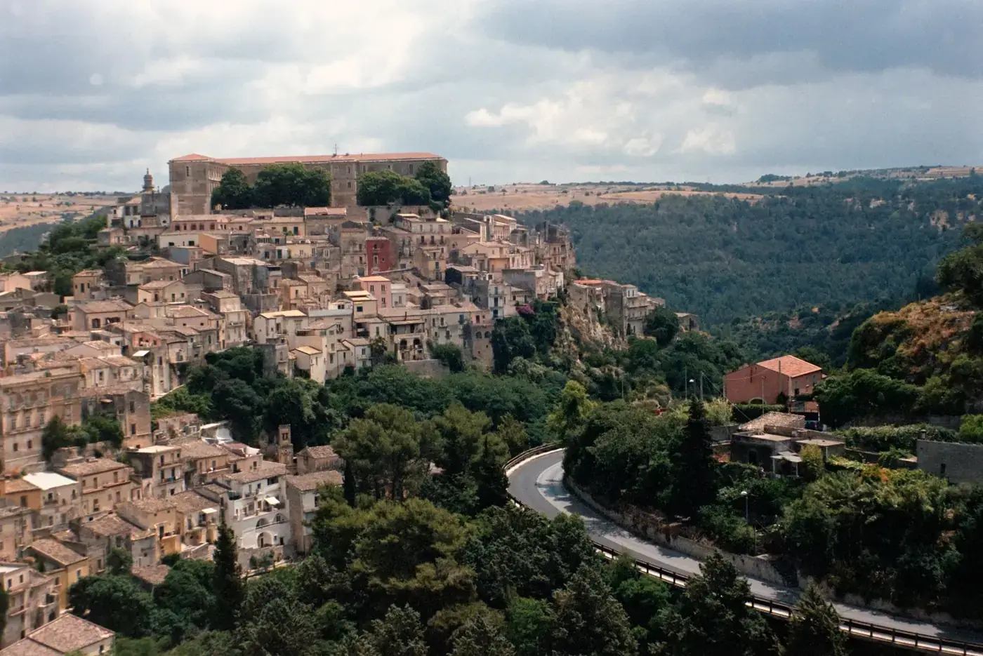 Picturesque aerial view of historic Ragusa Ibla, Sicily, surrounded by lush landscape.