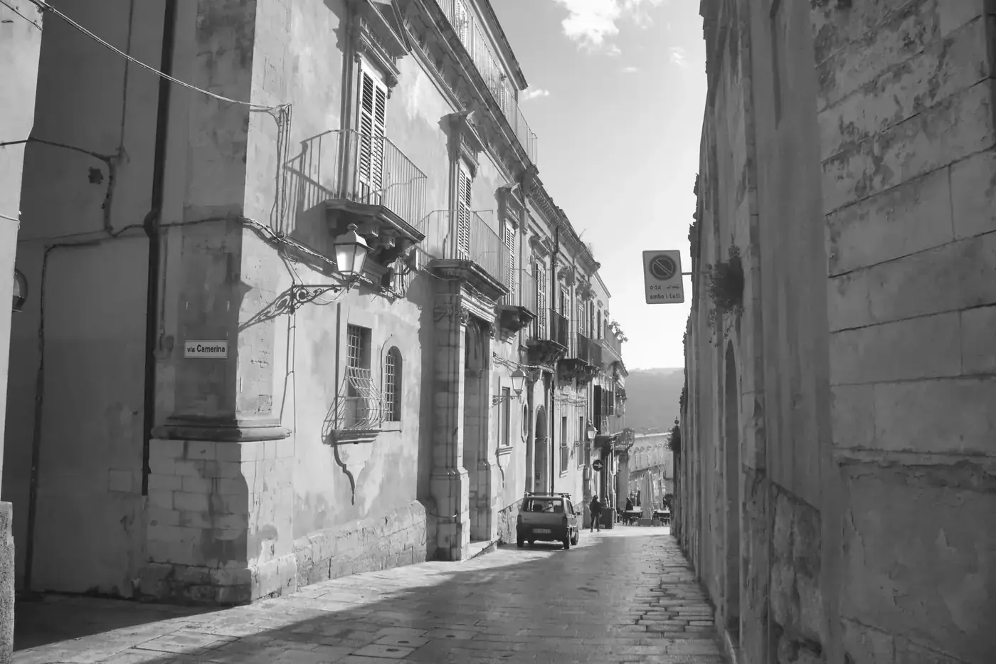 Charming street view in Ragusa, Sicily with baroque architecture, capturing Italian heritage.
