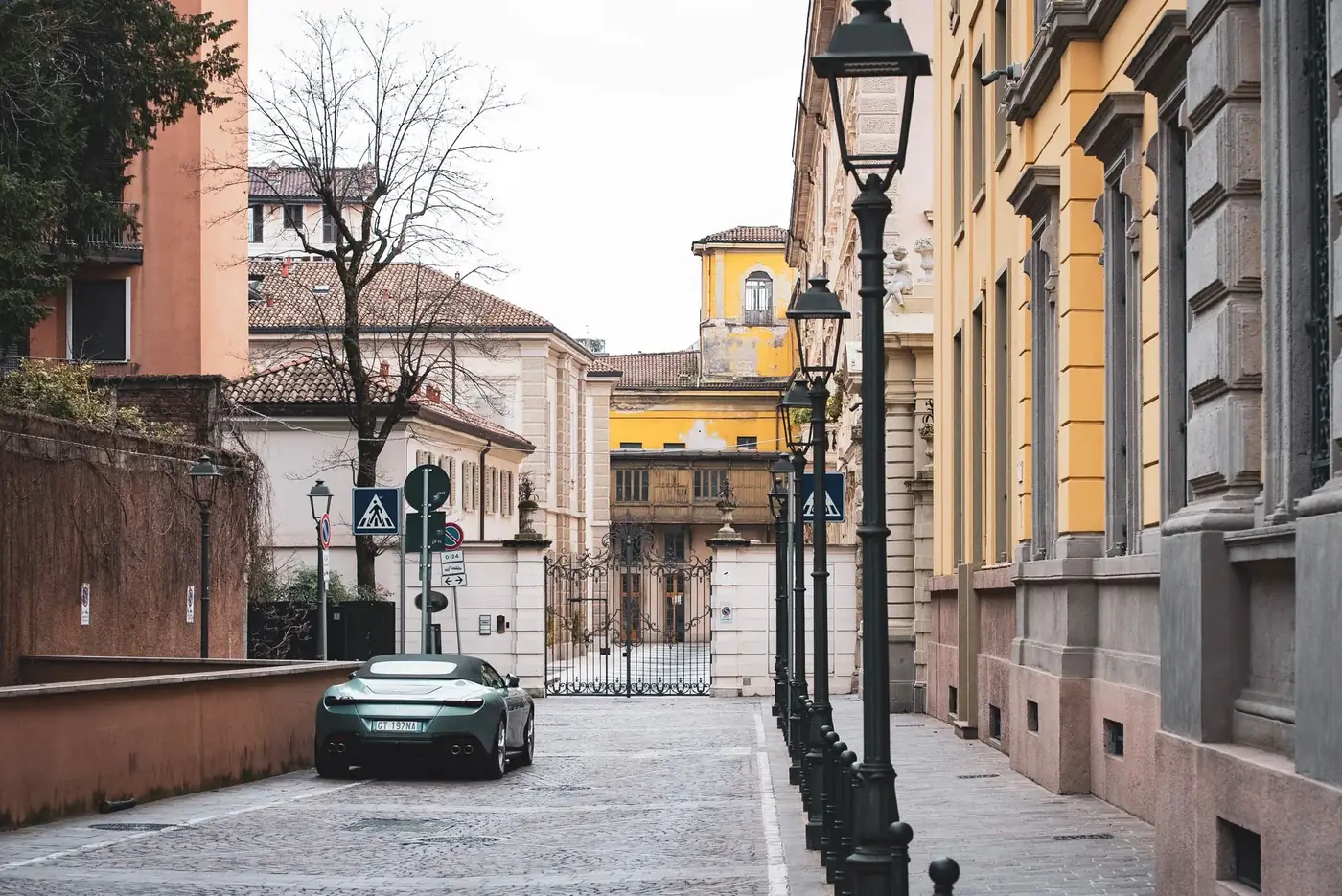 Charming street in Milan, Italy, showcasing vibrant historic architecture and a tranquil urban setting.