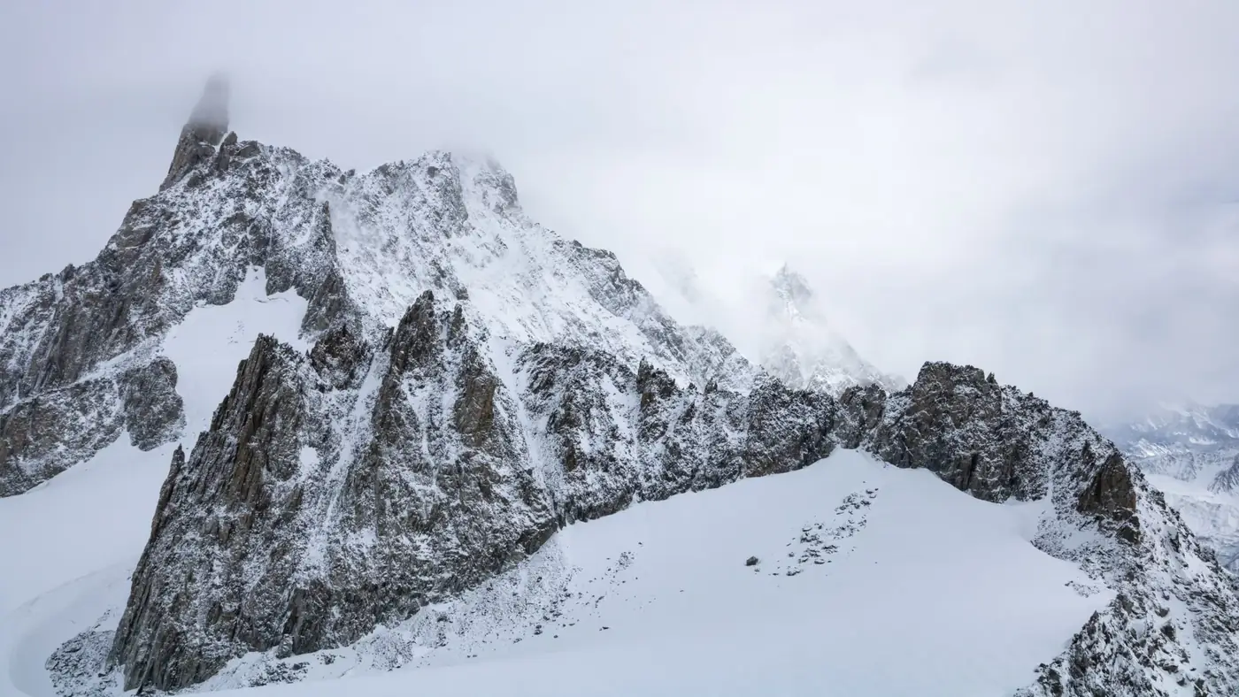 Stunning winter view of snow-covered peaks in Courmayeur, Italian Alps.