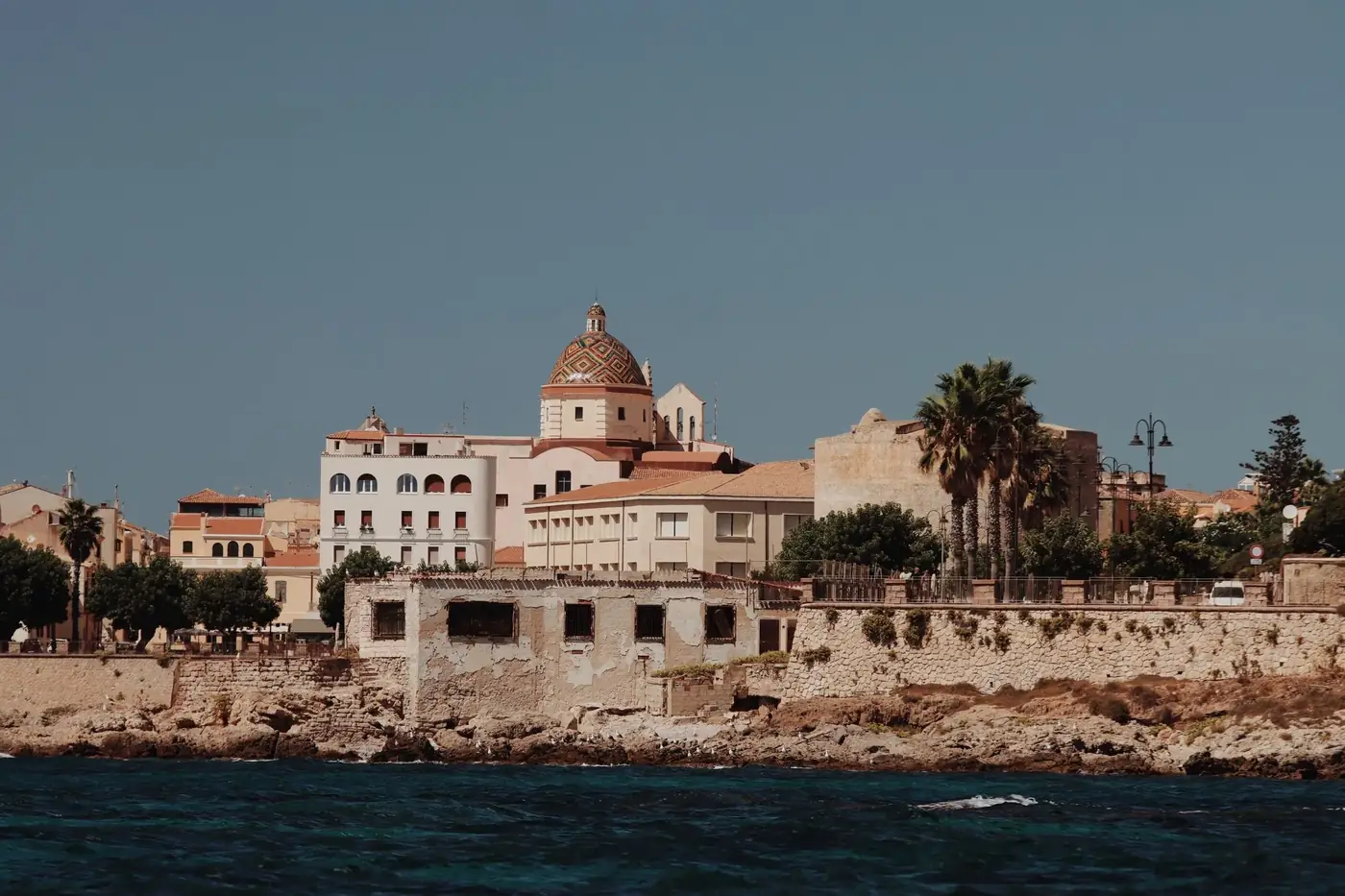 Explore the stunning historic architecture of Alghero, Sardinia showcasing Mediterranean charm and coastal beauty.