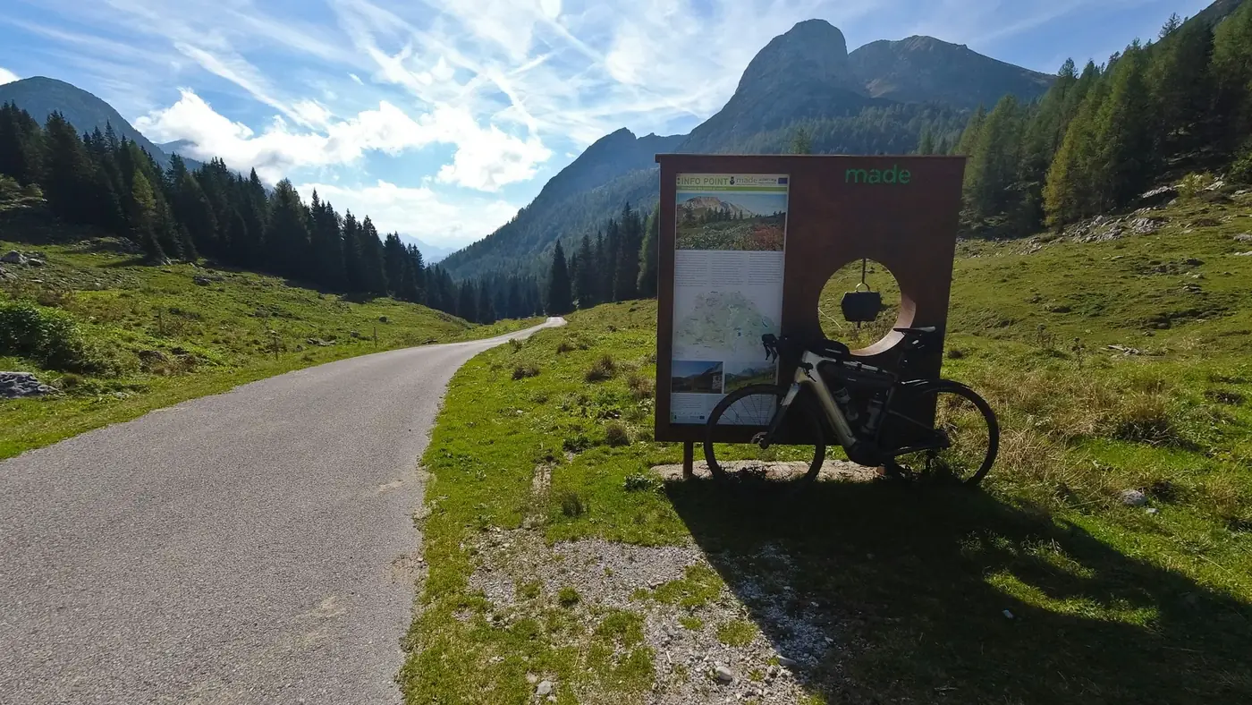 A panoramic view of the Julian Alps in Furlanija-Julijska krajina, Italy, captured in vibrant summer hues.