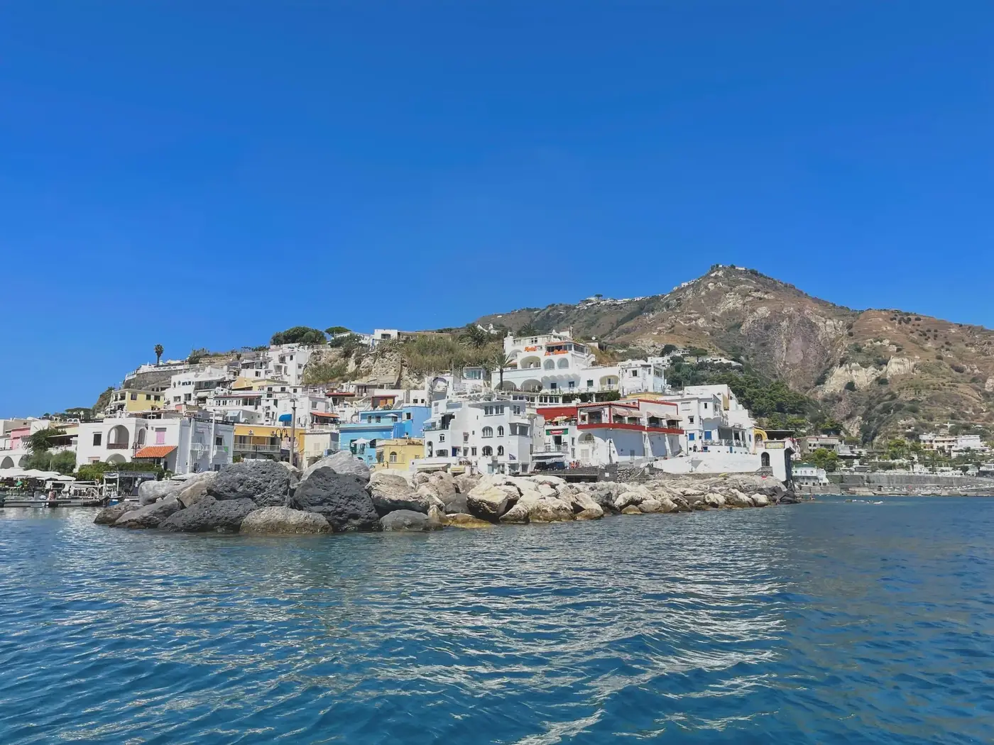 Charming coastal scene of Sant'Angelo in Campania, Italy bathed in sunlight.