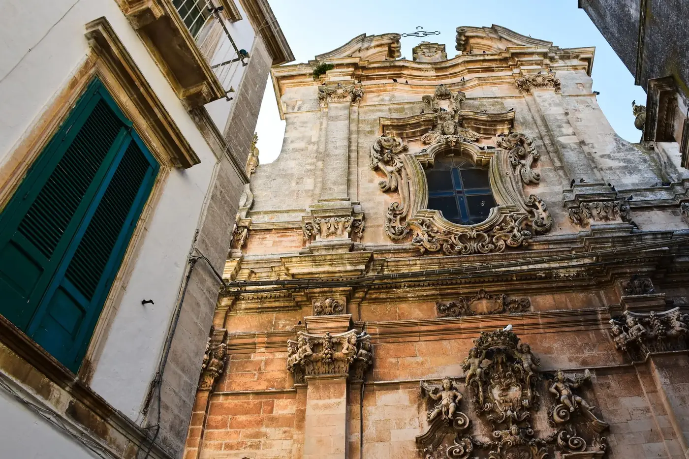 Stunning Baroque facade in Puglia, Italy showcasing intricate architectural details.