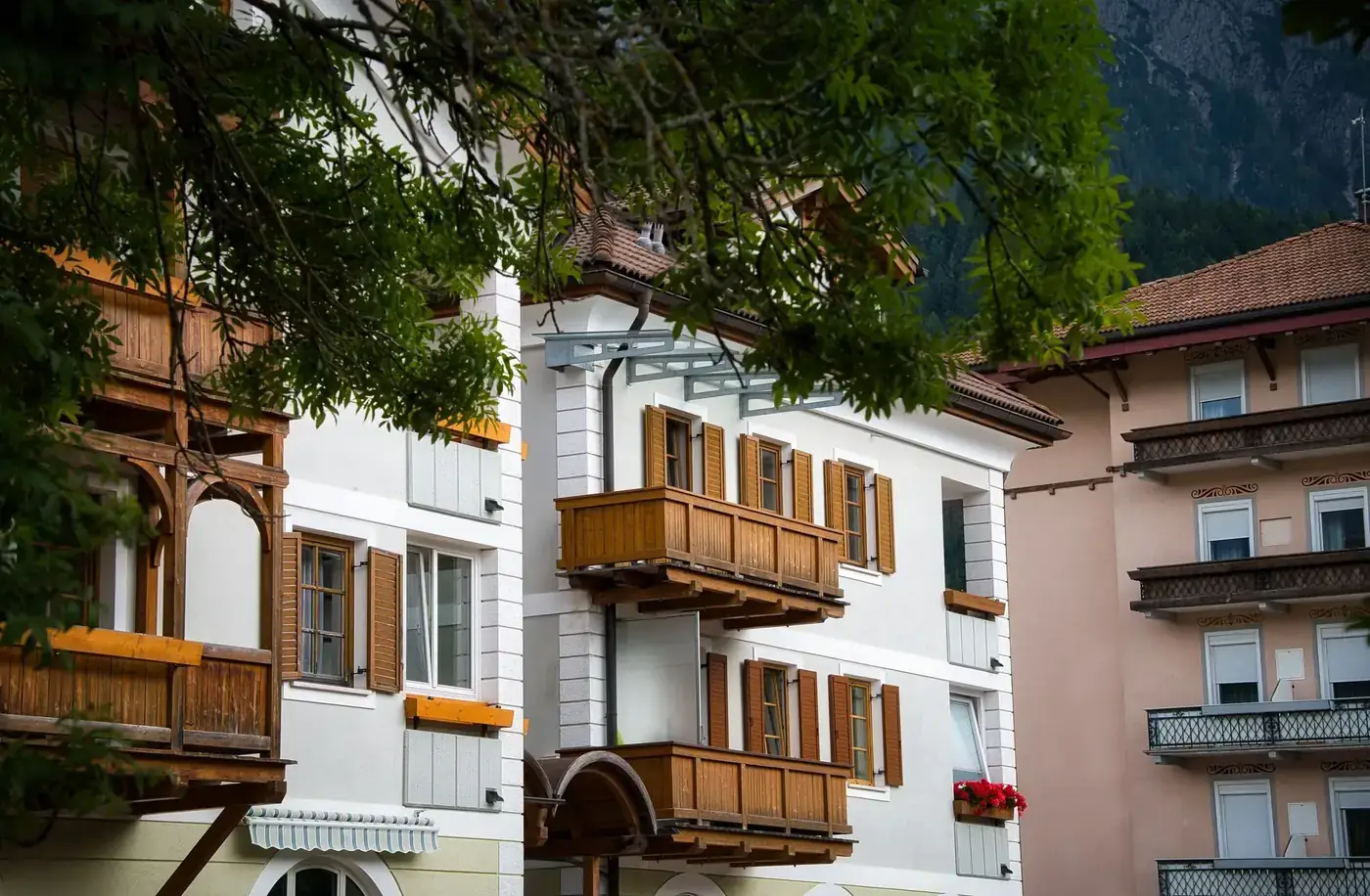 Traditional Alpine buildings with wooden balconies in Toblach, South Tyrol, Italy.