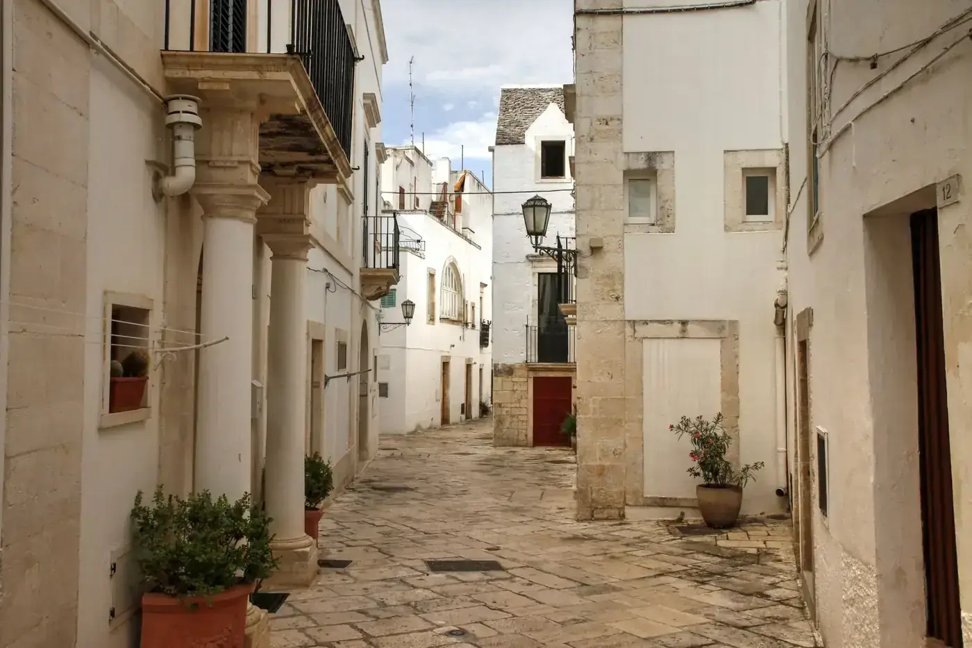 Explore the picturesque alleys and historic architecture of Locorotondo in Puglia, Italy.