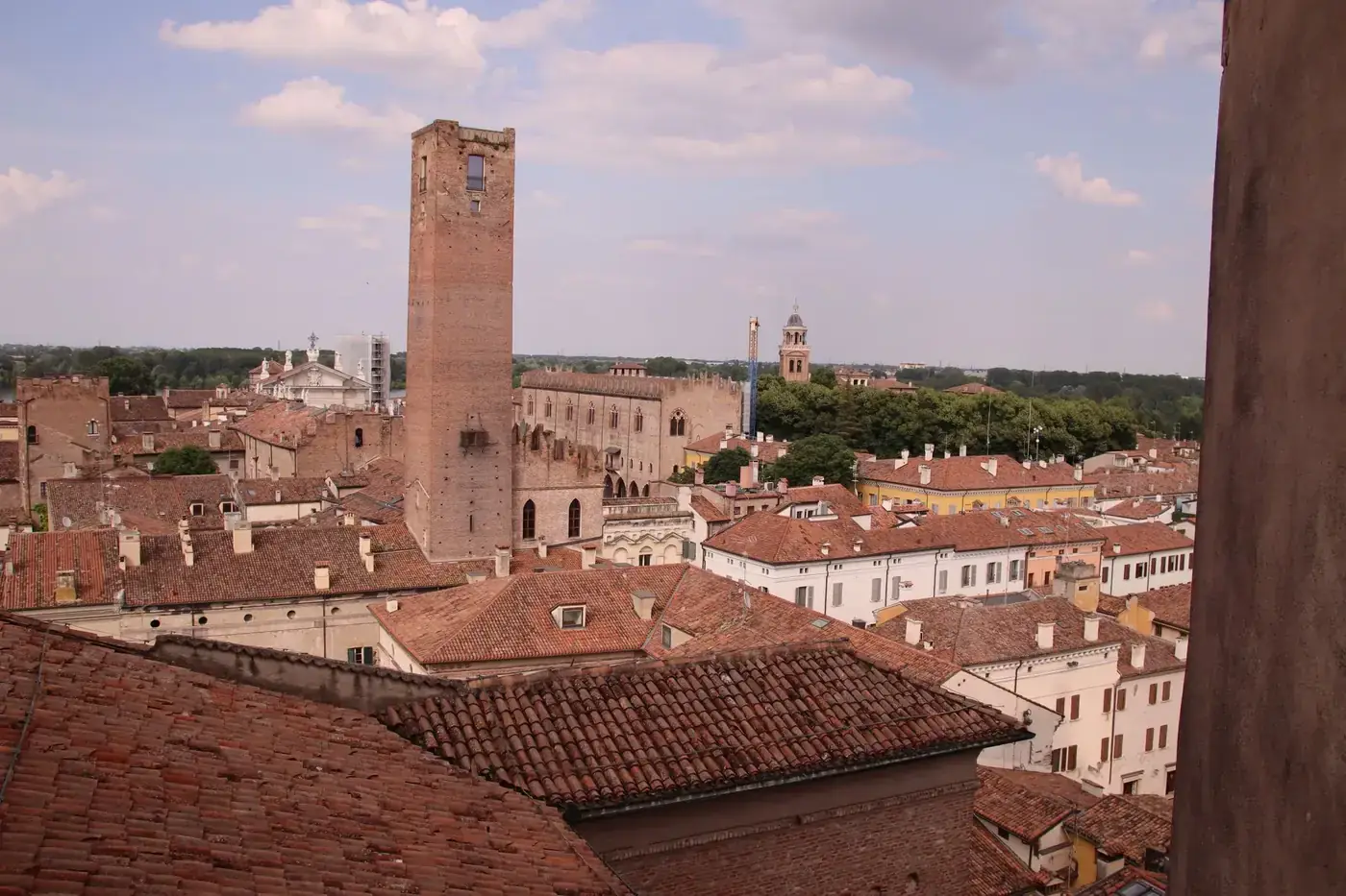 Scenic view of Mantova's historic architecture under a bright sky.