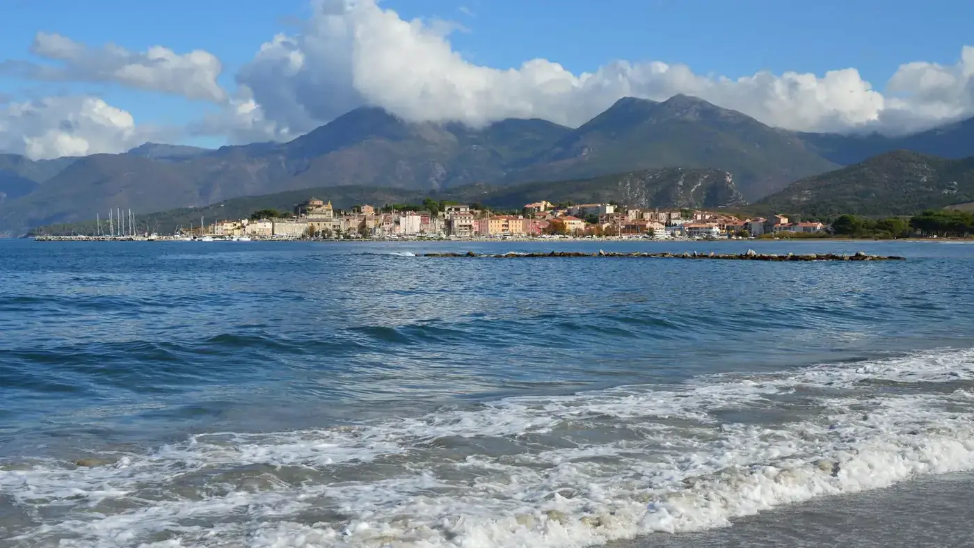 A scenic view of Saint-Florent, Corse with mountains and the sea. Perfect for travel inspiration.