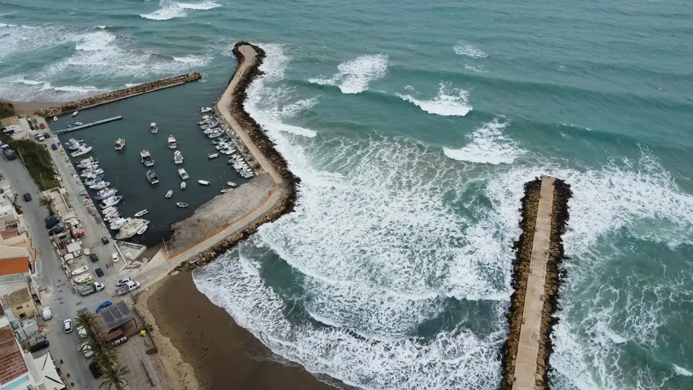 Aerial photograph capturing the scenic harbor of Selinunte, Sicily with boats and piers.