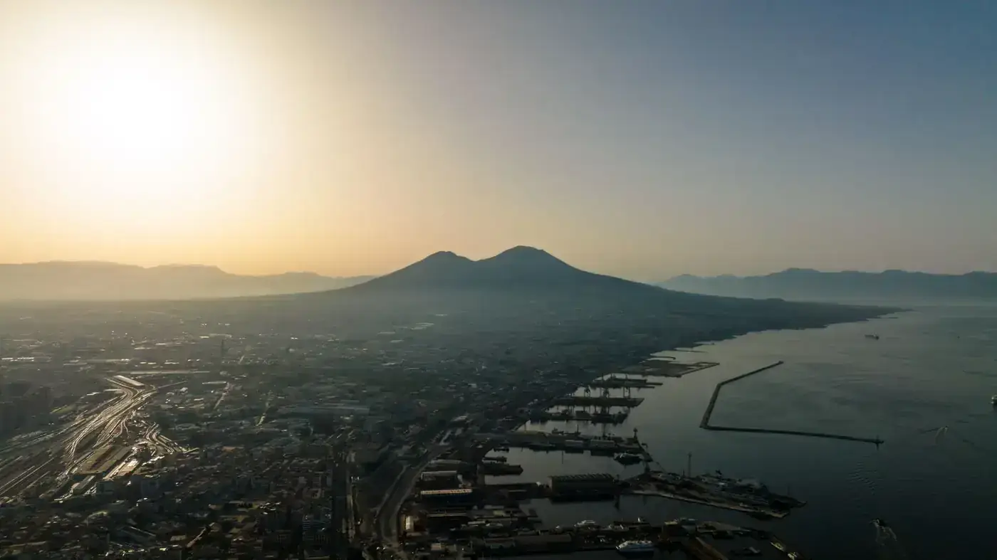 Scenic aerial view of Mount Vesuvius at sunrise over Naples, Italy.