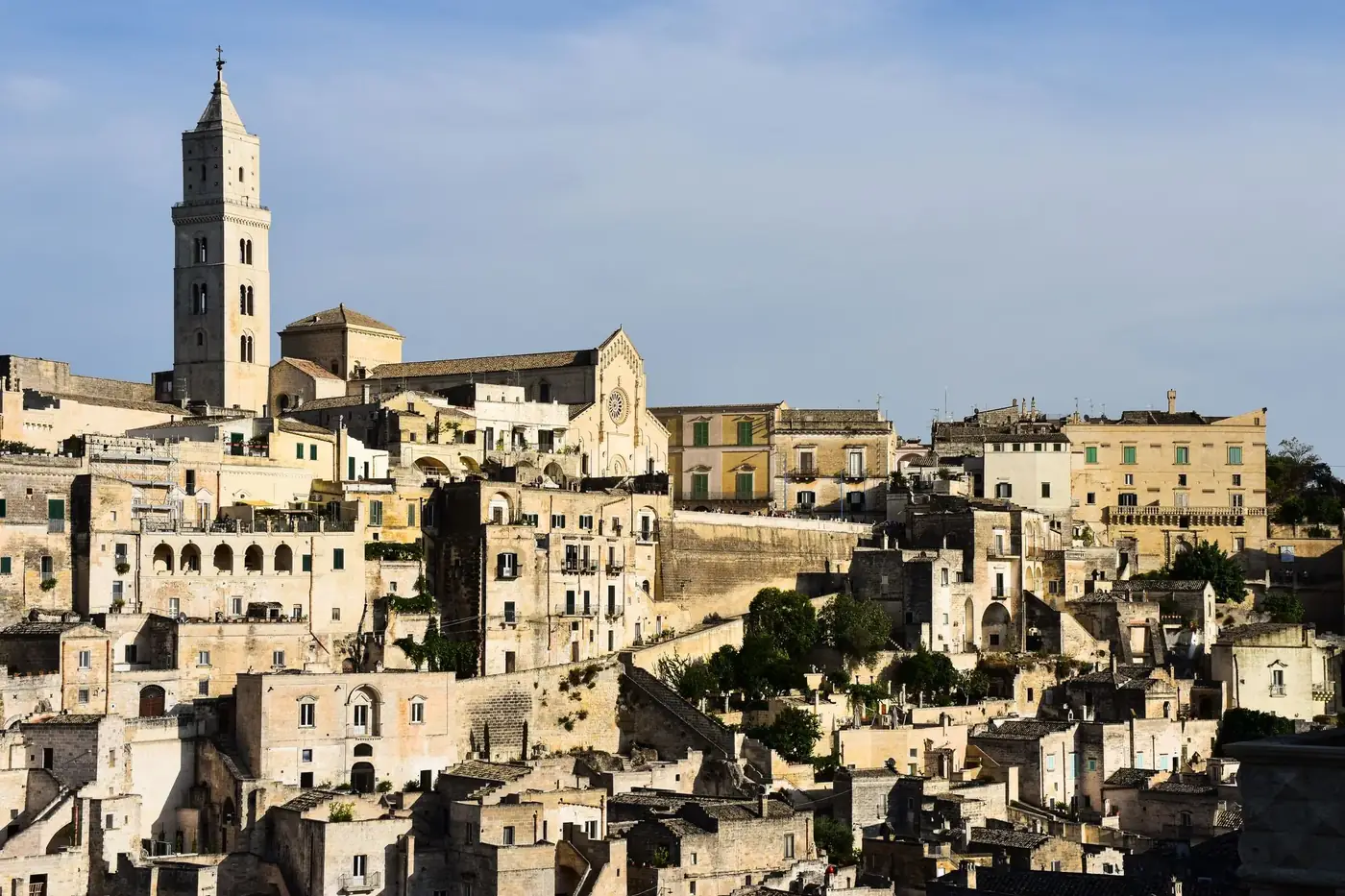 A captivating view of Matera's ancient, stone-built architecture under a clear sky.