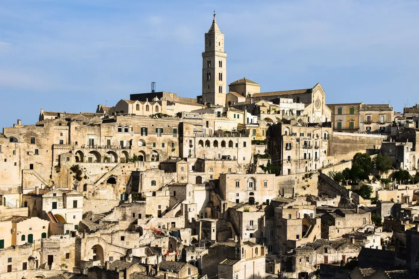 Stunning view of the ancient city of Matera, showcasing the iconic Sassi architecture bathed in daylight.
