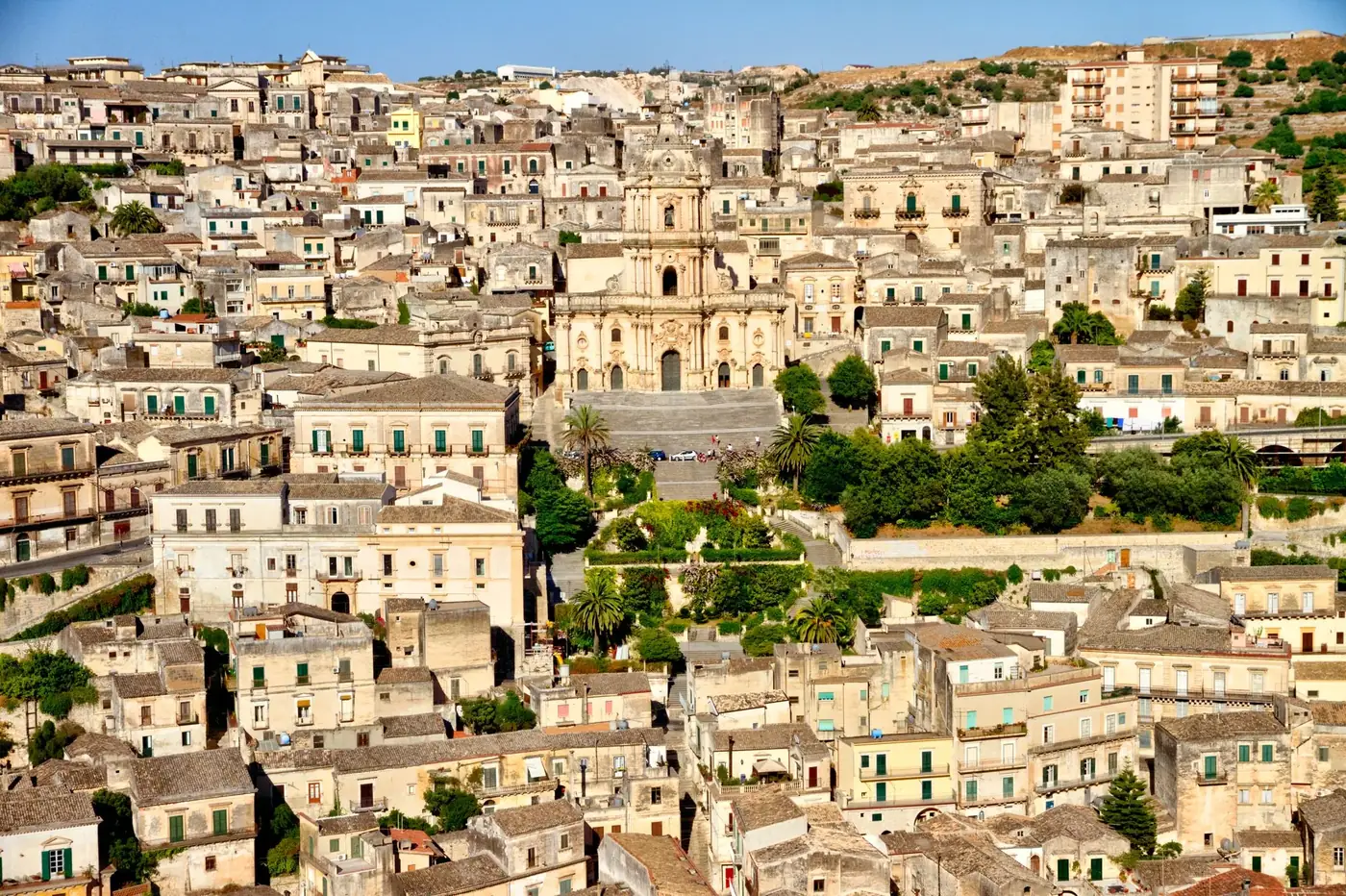 Stunning aerial shot of a historic Sicilian town featuring a grand Baroque cathedral.