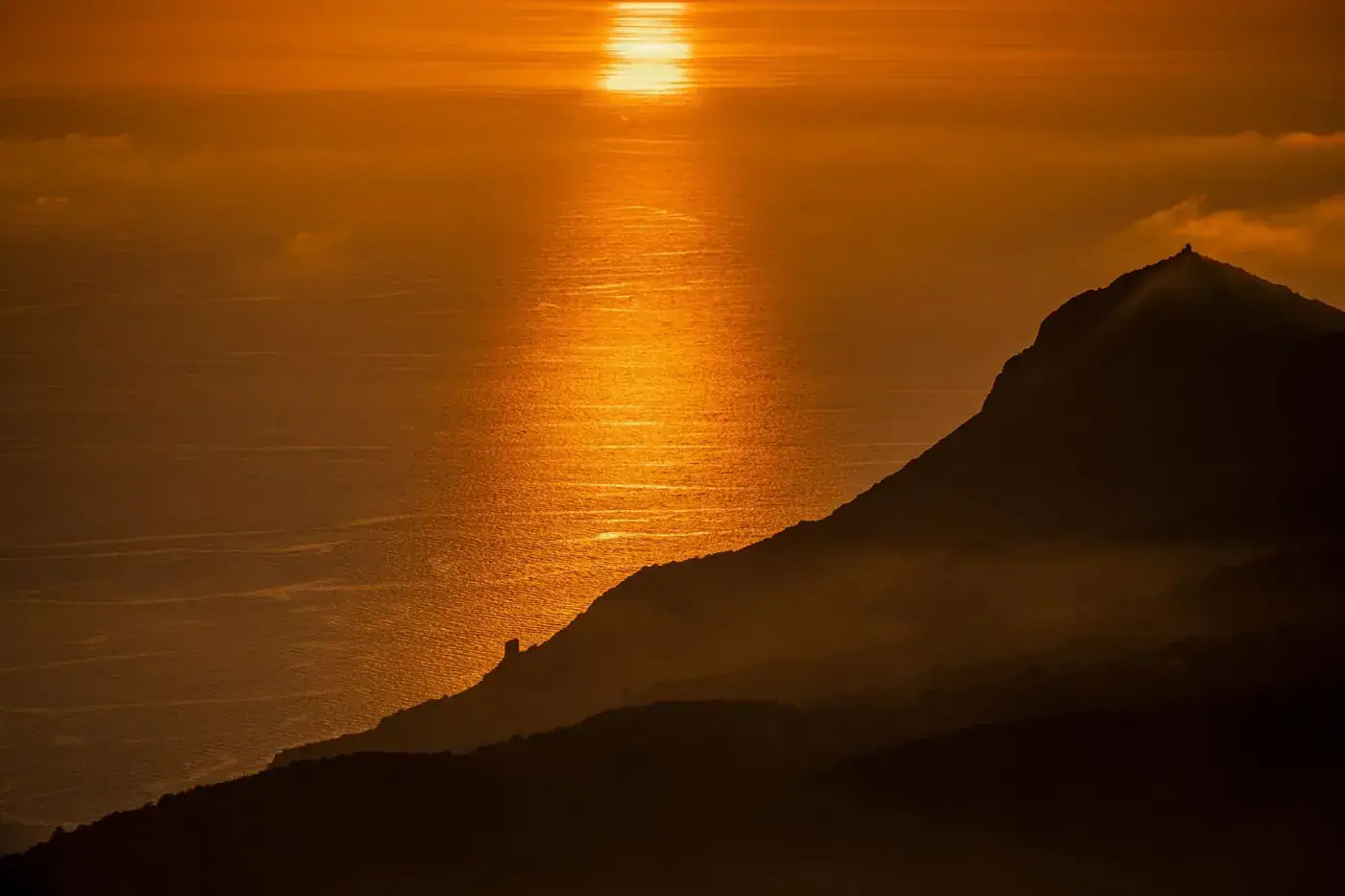 Stunning golden sunset view over Monte Argentario's coastline, Tuscany, Italy.