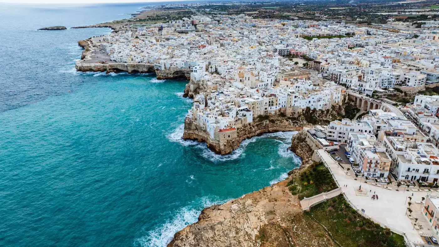 Stunning aerial view of Polignano a Mare, Italy, showcasing its coastal beauty and historic architecture.