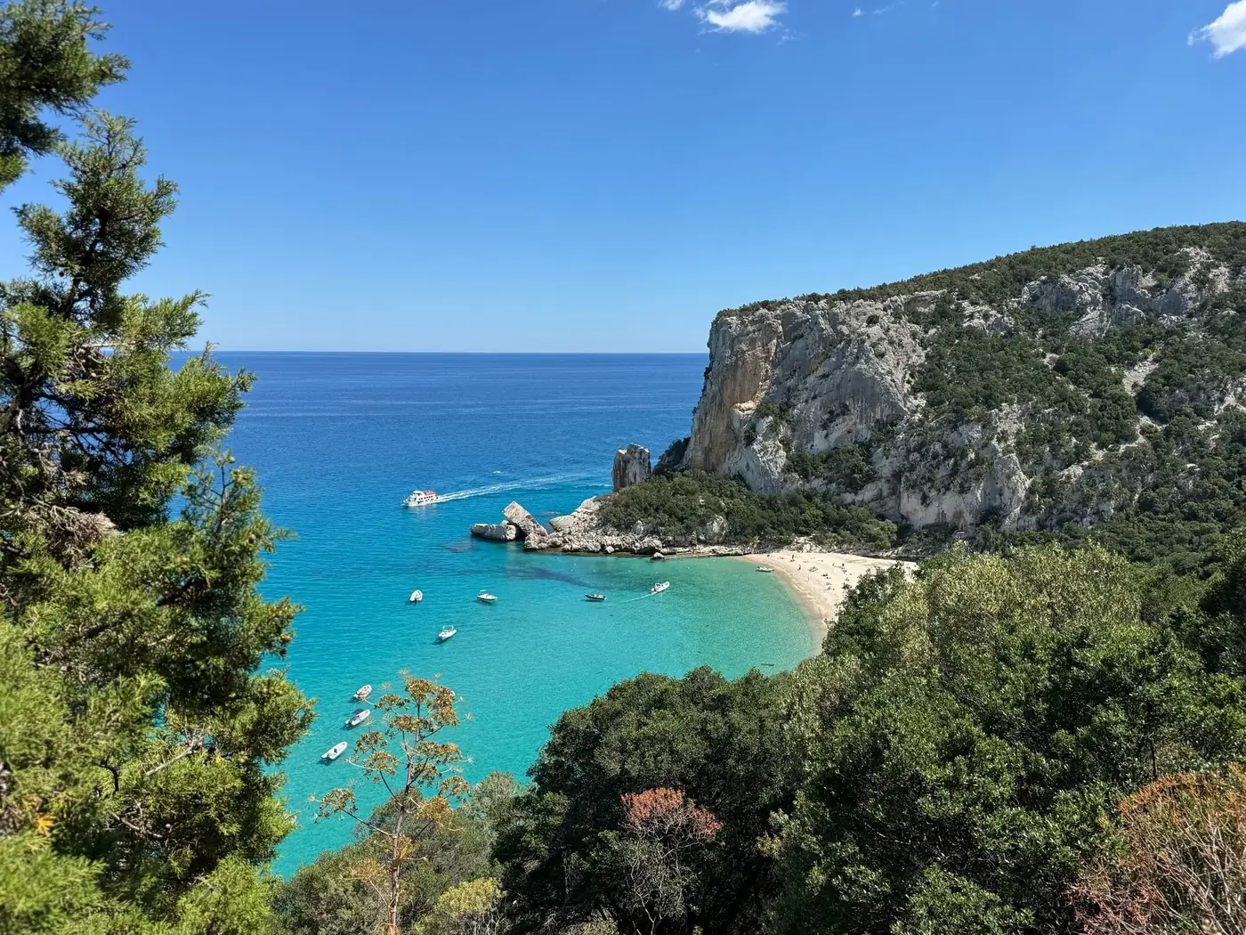 Beautiful view of Cala Goloritzé beach with turquoise waters and cliffs in Sardinia, Italy.