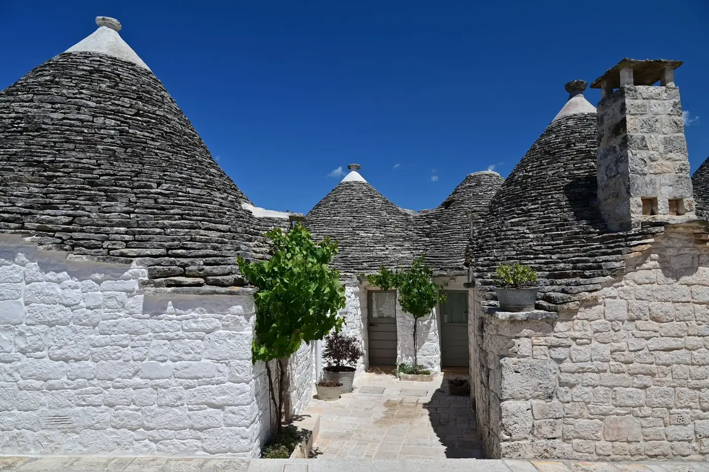 Discover the iconic Trulli houses with conical roofs in Alberobello, Apulia, Italy.