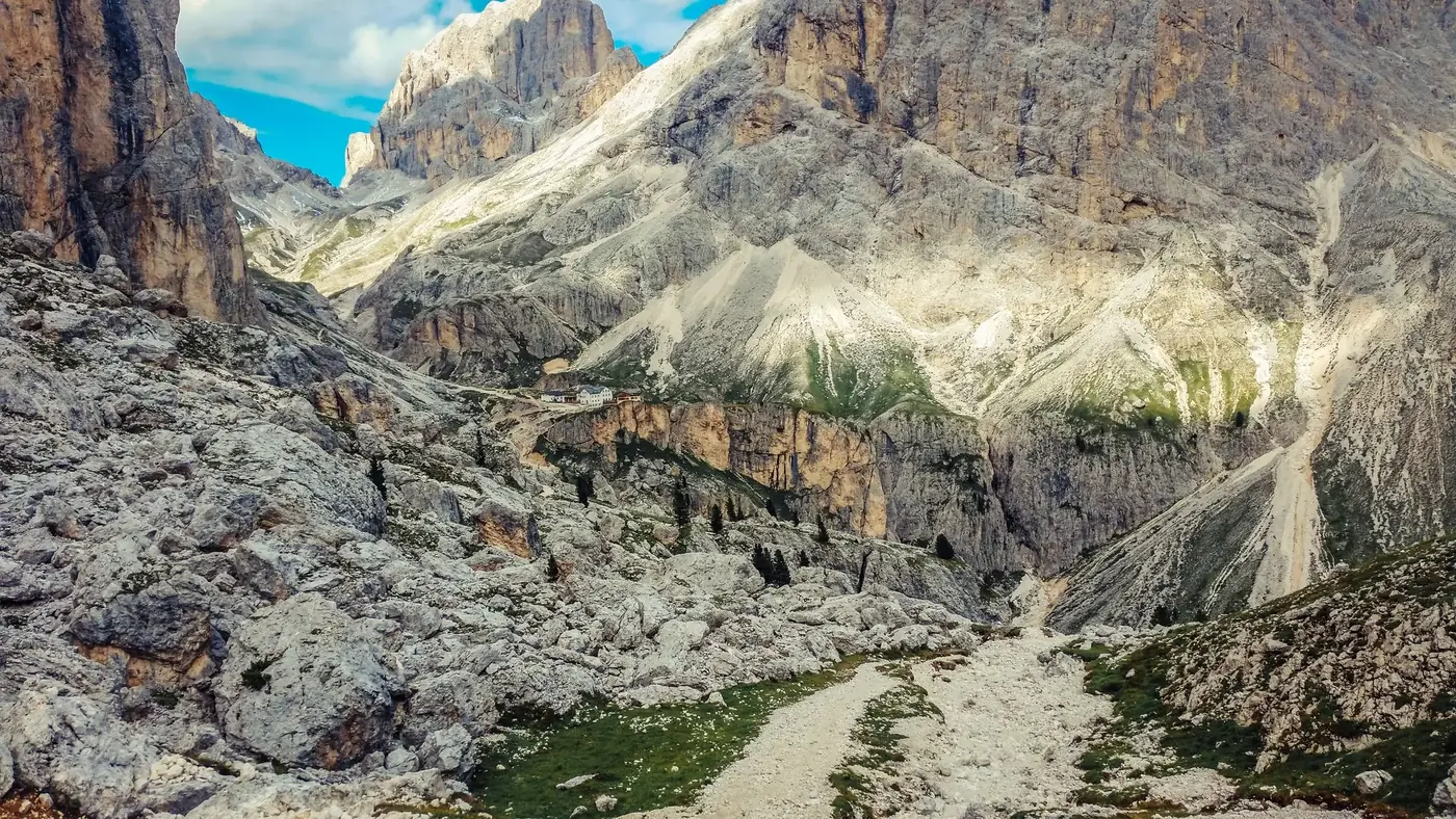 Breathtaking view of the Dolomites in autumn with rugged terrain and clear skies.