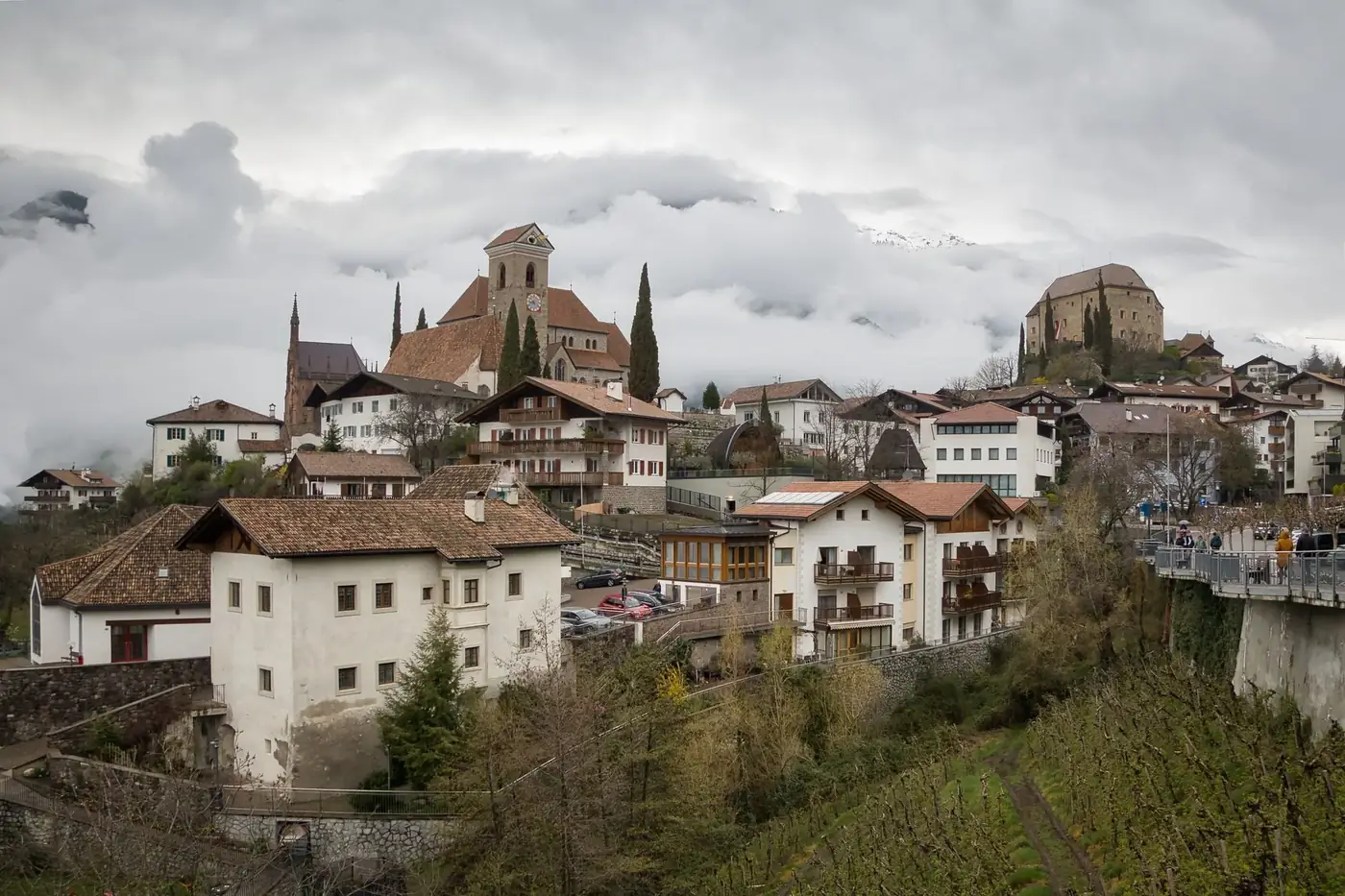 Charming village of Schenna in Trentino-Südtirol, Italy, with stunning architecture and mountain backdrop.