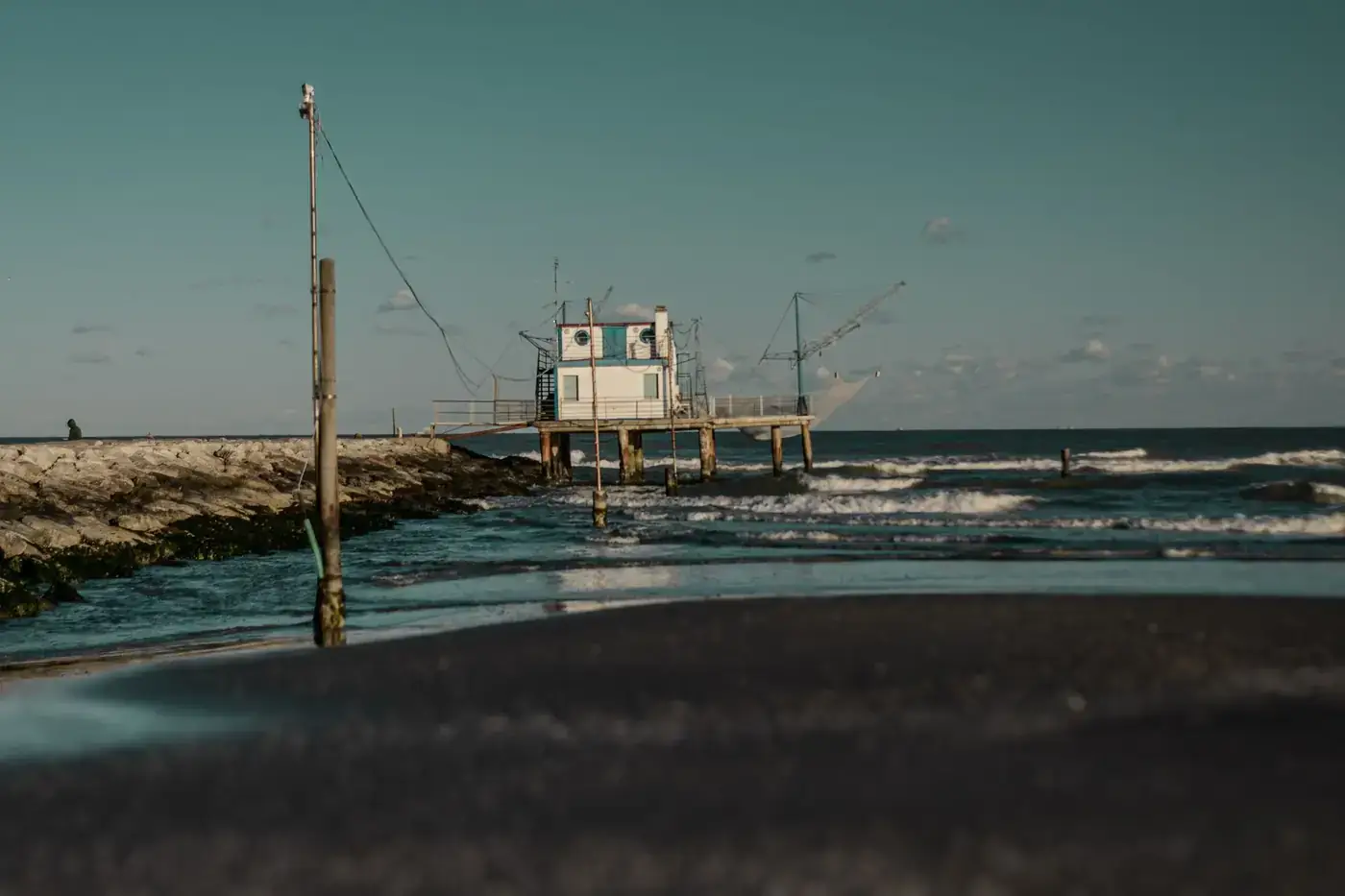 Rustic fishing hut on a pier by the sea in Marina Romea, Emilia-Romagna, Italy