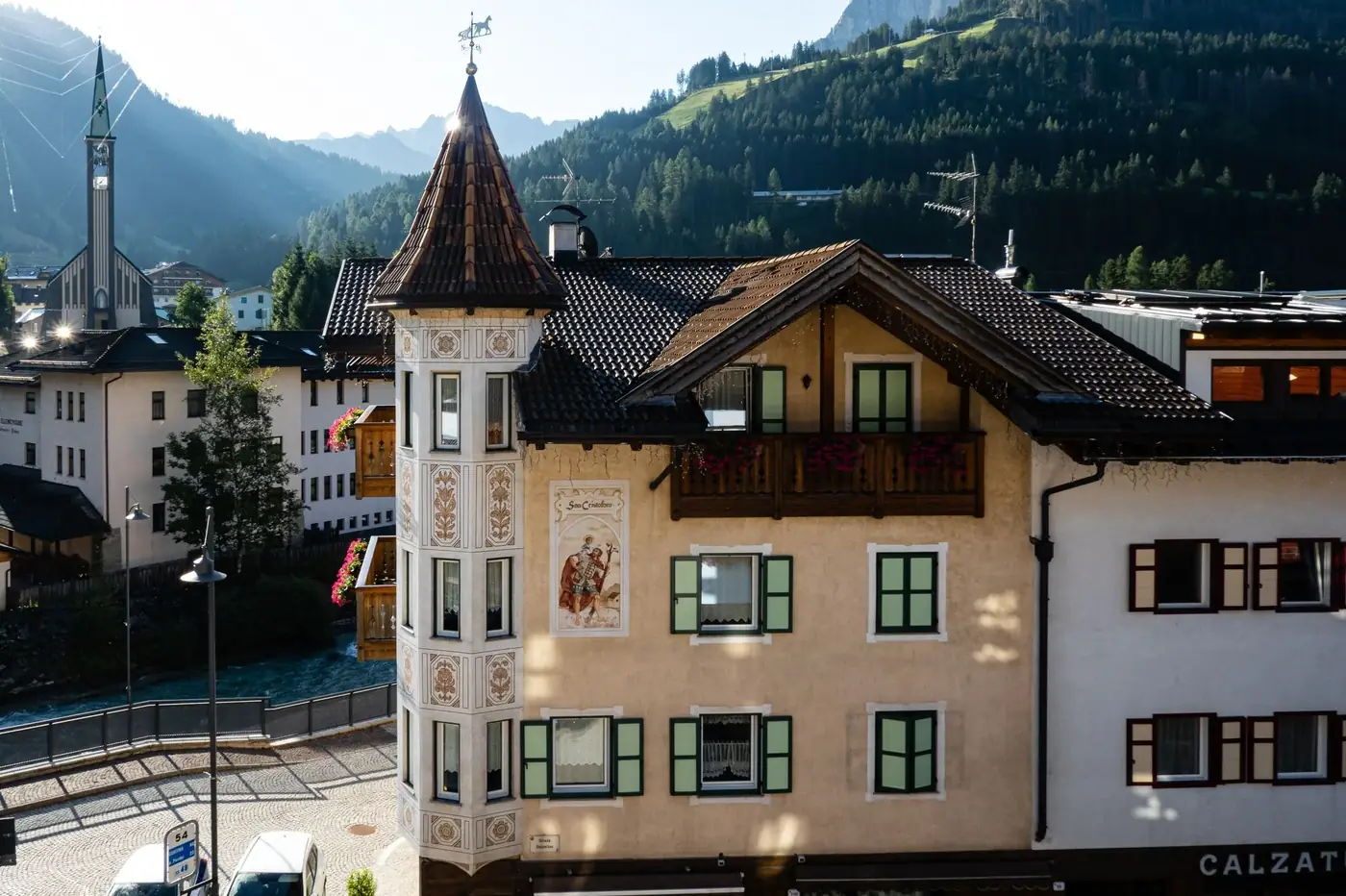 Picturesque alpine village with traditional architecture under a clear blue sky.