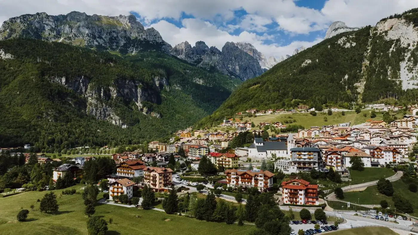 A picturesque view of Molveno village with mountains in Trentino, Italy.
