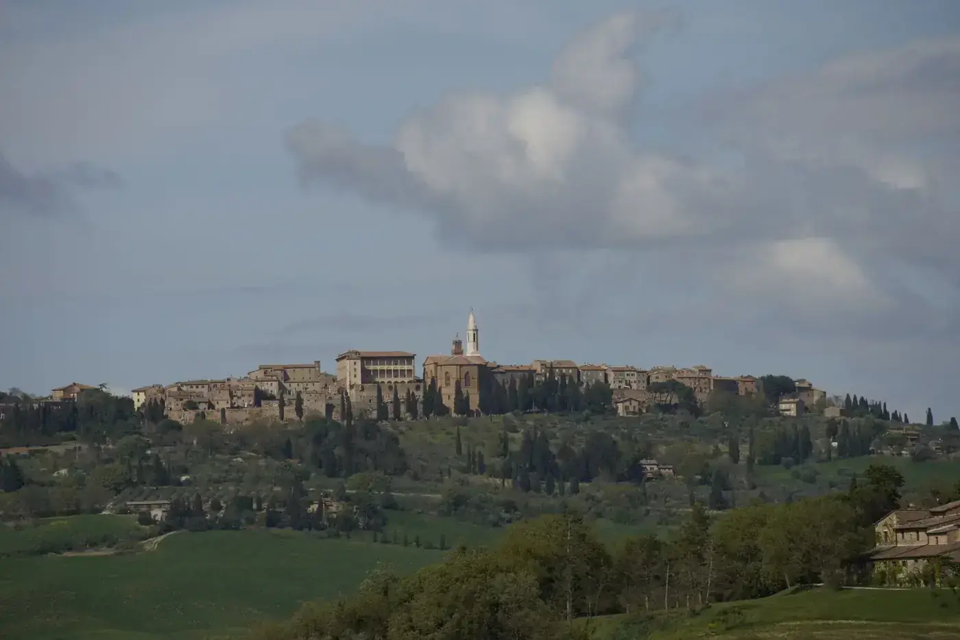 A panoramic view of the historic town of Pienza, Tuscany, with Renaissance architecture.