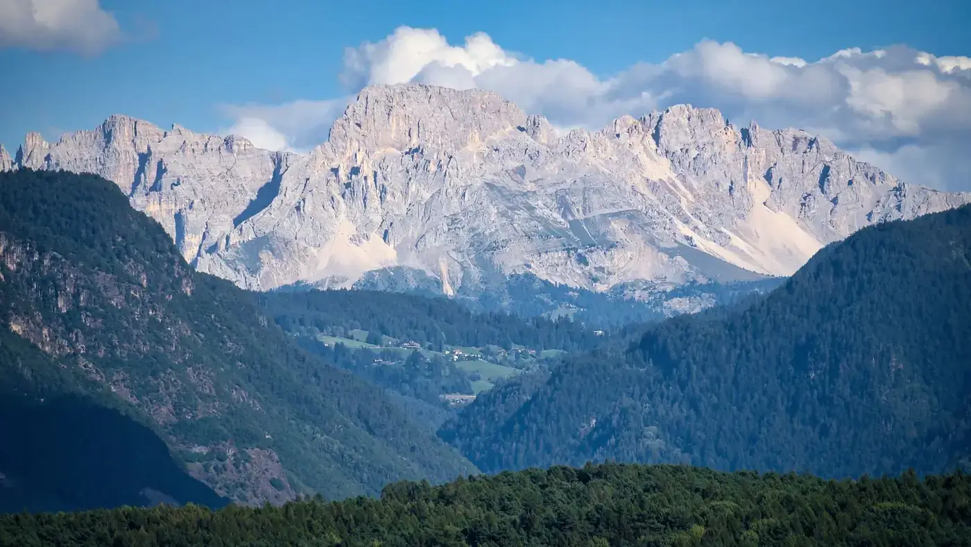 Breathtaking view of the Italian Alps under a clear blue sky in Trentino-Südtirol.