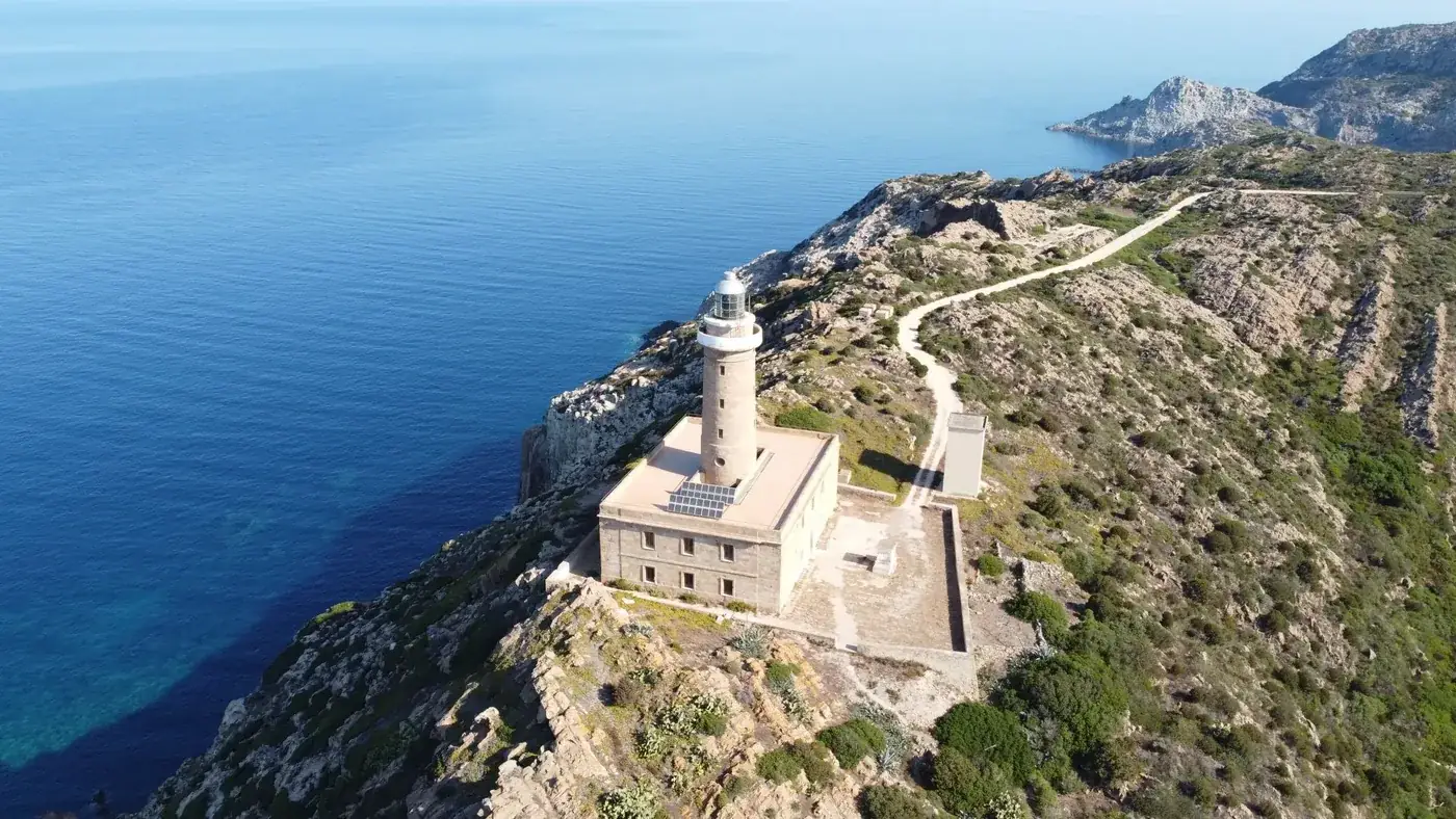Stunning aerial shot of the Capo Sandalo Lighthouse on San Pietro Island, Sardinia.